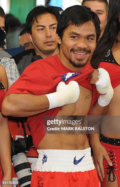 Welterweight boxing champion Manny "PacMan" Pacquiao of the Philippines shows his fitness as he prepares for his fight against Miguel Cotto at the...