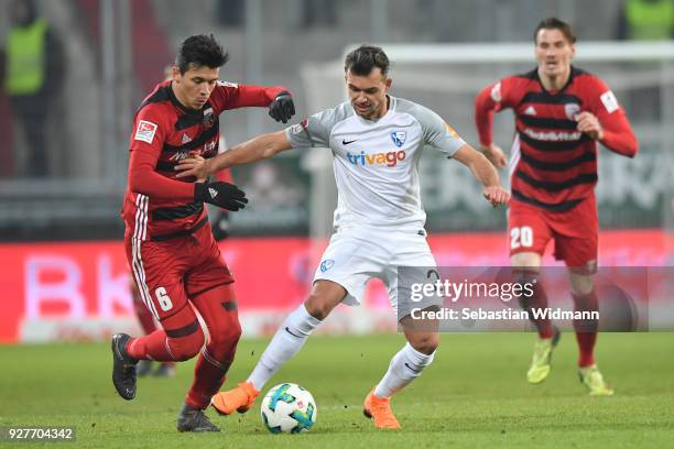 Alfredo Morales of Ingolstadt and Kevin Stoeger of Bochum compete for the ball during the Second Bundesliga match between FC Ingolstadt 04 and VfL...