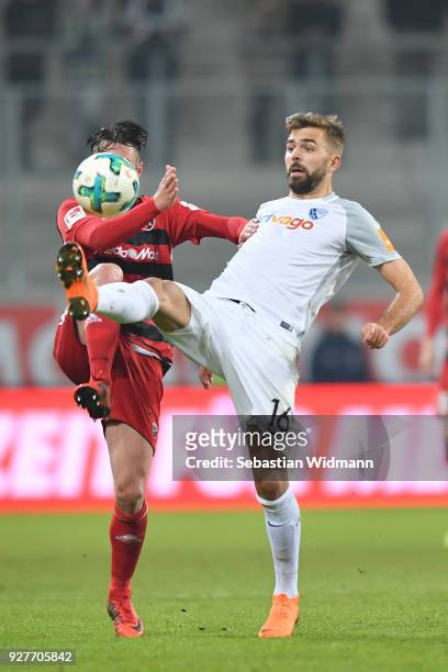 Christian Traesch of Ingolstadt and Lukas Hinterseer of Bochum compete for the ball during the Second Bundesliga match between FC Ingolstadt 04 and...