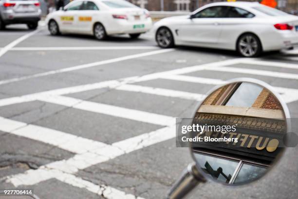 Urban Outfitters Inc. Signage is reflected in the mirror of a Piaggio Vespa BV scooter in Boston, Massachusetts, U.S., on Sunday, March 4, 2018....