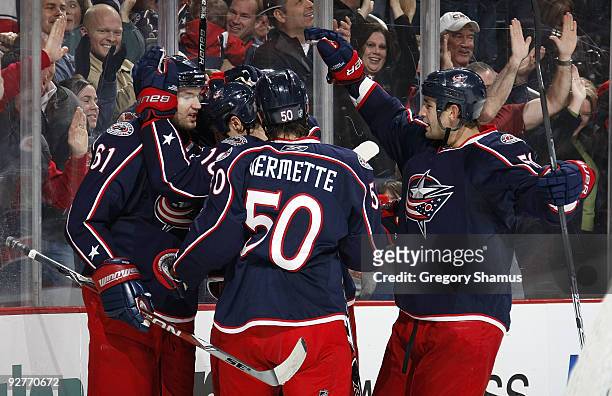 Rick Nash of the Columbus Blue Jackets celebrates his second-period goal with Antoine Vermette and Fedor Tyutin while playing the San Jose Sharks on...