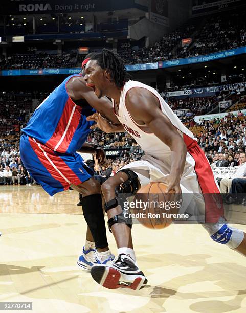 Chris Bosh of the Toronto Raptors drives baseline toward the hoop against Ben Wallace of the Detroit Pistons during a game on November 4, 2009 at the...