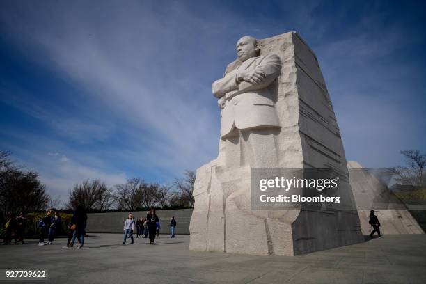 Visitors walk next to the Martin Luther King Jr. Memorial in Washington, D.C., U.S., on Wednesday, Feb. 28, 2018. The U.S. Senate is expected to...