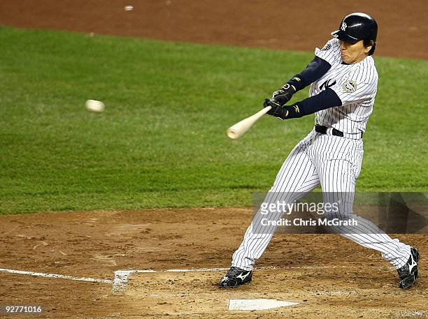 Hideki Matsui of the New York Yankees hits a 2-run single in the bottom of the third inning against the Philadelphia Phillies in Game Six of the 2009...