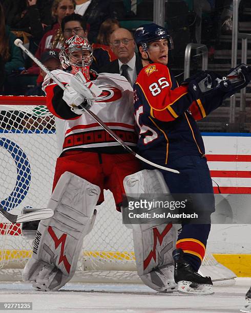 Rostislav Olesz of the Florida Panthers backs into goaltender Cam Ward of the Carolina Hurricanes during the second period on November 4, 2009 at the...