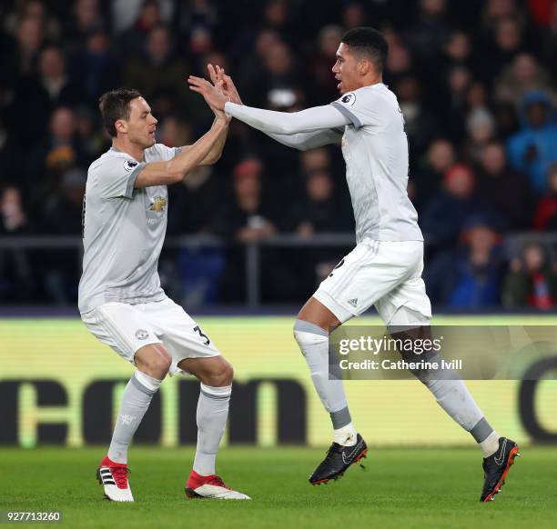 Chris Smalling of Manchester United celebrates scoring the first Manchester United goal with Nemanja Matic during the Premier League match between...