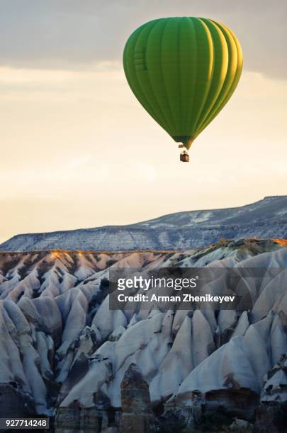 air balloon flying of the cappadocia rocks - cappadocia hot air balloon stock pictures, royalty-free photos & images