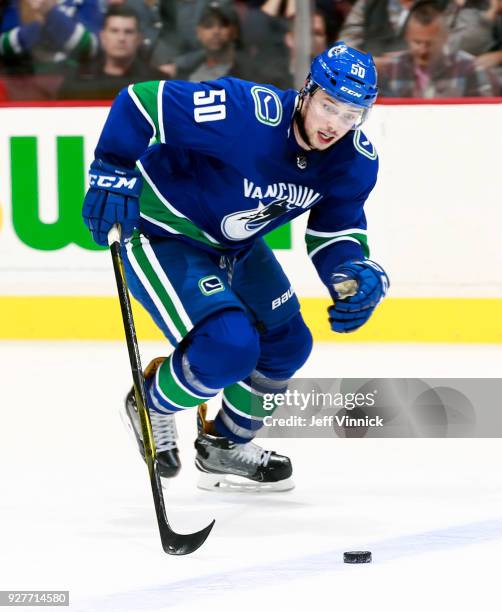 Brendan Gaunce of the Vancouver Canucks skates up ice with the puck during their NHL game against the Chicago Blackhawks at Rogers Arena December 28,...