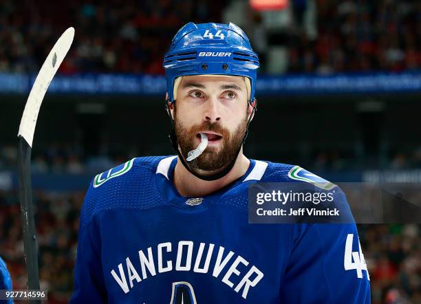 Erik Gudbranson of the Vancouver Canucks looks on from the bench during their NHL game against the Chicago Blackhawks at Rogers Arena December 28,...