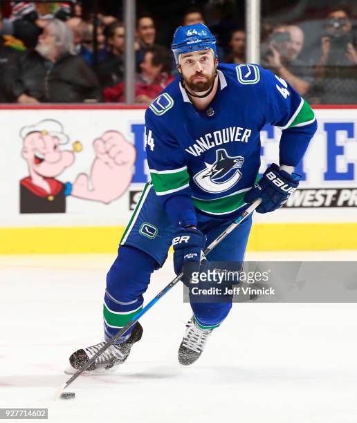 Erik Gudbranson of the Vancouver Canucks skates up ice with the puck during their NHL game against the Chicago Blackhawks at Rogers Arena December...