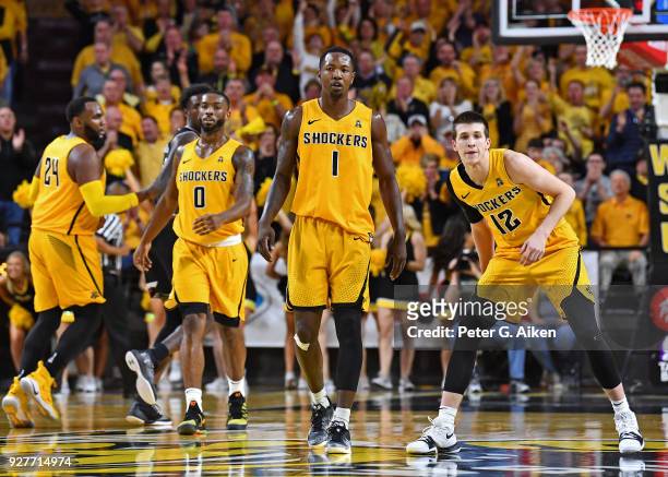 Zach Brown and Austin Reaves of the Wichita State Shockers look down court during the first half against the Cincinnati Bearcats on March 4, 2018 at...