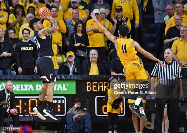 Jarron Cumberland of the Cincinnati Bearcats shoots the ball against Landry Shamet of the Wichita State Shockers during the first half on March 4,...