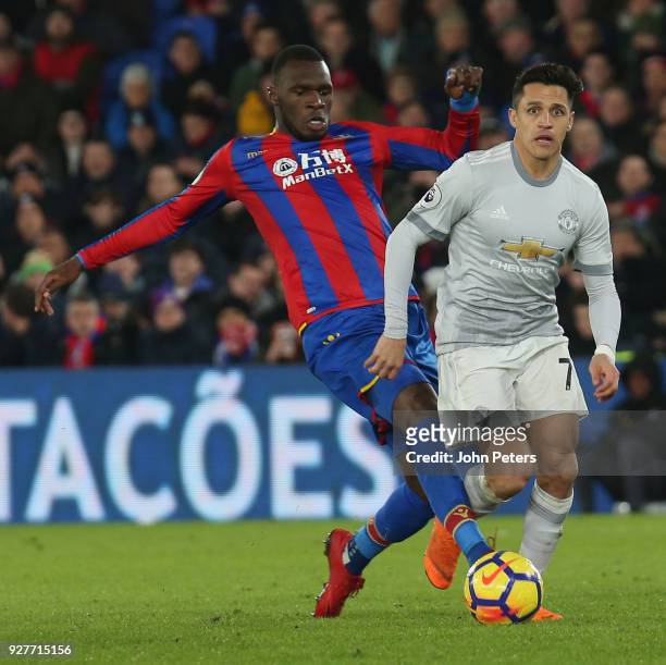 Alexis Sanchez of Manchester United in action with Christian Benteke of Crystal Palace during the Premier League match between Crystal Palace and...