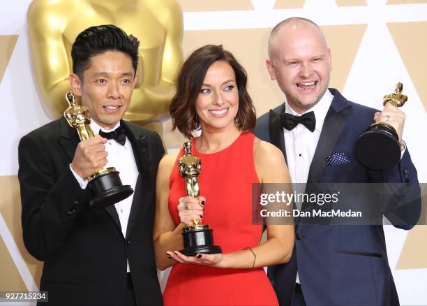 Make-up artists Kazuhiro Tsuji, Lucy Sibbick, and David Malinowski, winners of the Best Makeup and Hairstyling award for 'Darkest Hour,' pose in the...