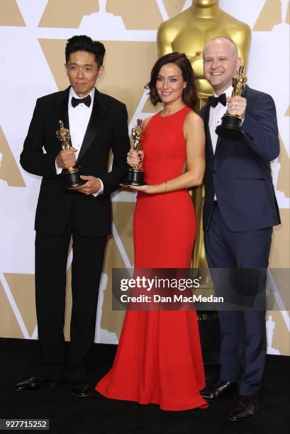 Make-up artists Kazuhiro Tsuji, Lucy Sibbick, and David Malinowski, winners of the Best Makeup and Hairstyling award for 'Darkest Hour,' pose in the...