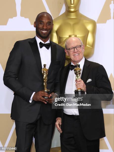 Filmmakers Kobe Bryant and Glen Keane, winners of the Best Animated Short Film award for 'Dear Basketball,' pose in the press room at the 90th Annual...