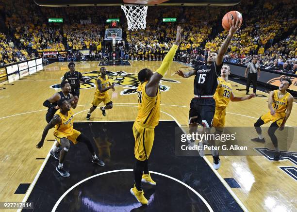 Cane Broome of the Cincinnati Bearcats drives to the basket against Shaquille Morris of the Wichita State Shockers during the first half on March 4,...