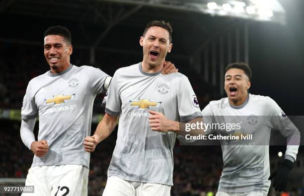 Nemanja Matic of Manchester United celebrates scoring the third Manchester United goal with Chris Smalling and Jesse Lingard during the Premier...