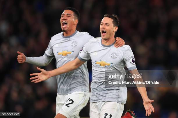 Nemanja Matic of Manchester United celebrates his late winning goal with Chris Smalling during the Premier League match between Crystal Palace and...