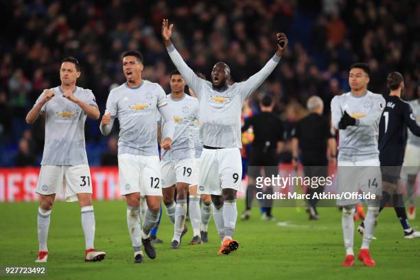 Romelu Lukaku, Chris Smalling and Nemanja Matic of Manchester United lead the celebrations during the Premier League match between Crystal Palace and...