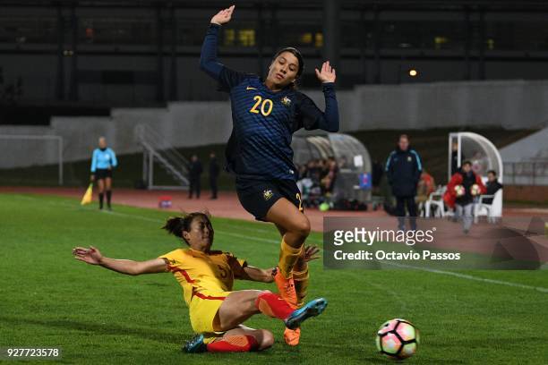 Sam Kerr of Australia competes for the ball with Wu Haiyan of China during the Women's Algarve Cup Tournament match between Australia and China at...
