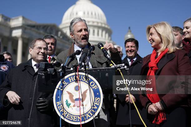 Comedian Jon Stewart speaks as U.S. Rep. Carolyn Maloney and Rep. Jerrold Nadler listen during a news conference March 5, 2018 on Capitol Hill in...