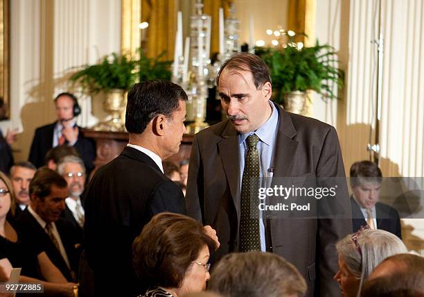 David Axelrod , White House senior advisor, speaks with Eric K. Shinseki, Secretary of Veterans Affairs, at an event hosted by U.S. President Barack...