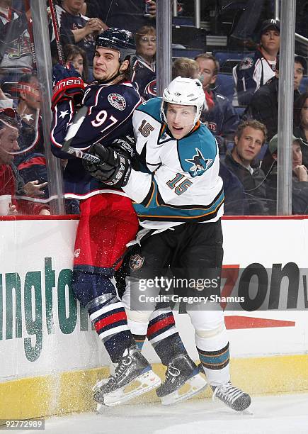 Dany Heatley of the San Jose Sharks checks Rostislav Klesla of the Columbus Blue Jackets on November 4, 2009 at Nationwide Arena in Columbus, Ohio....