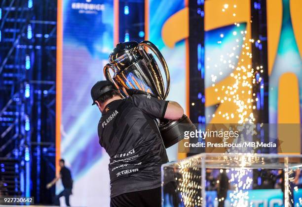 Robin flusha Ronnquist walks off the stage with the winners' cup after Counter-Strike: Global Offensive final game between FaZe Clan and Fnatic on...