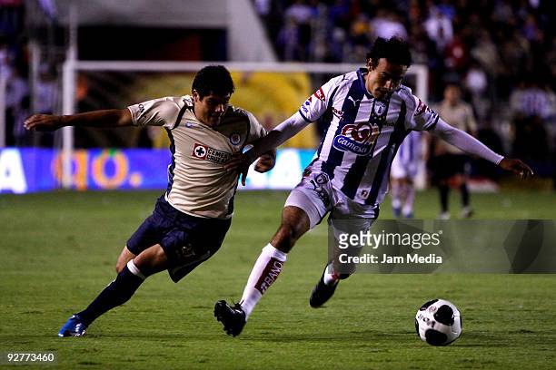 Damian Manso of Pachuca vies for the ball with Javier Orozco of Cruz Azul during their Mexican league Apertura 2009 soccer match at the Hidalgo...
