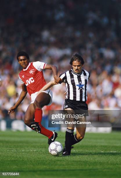 Arsenal player David Rocastle challenges Alan Davies of Newcastle United during a First Divsion match at Highbury on September 28, 1985 in London,...