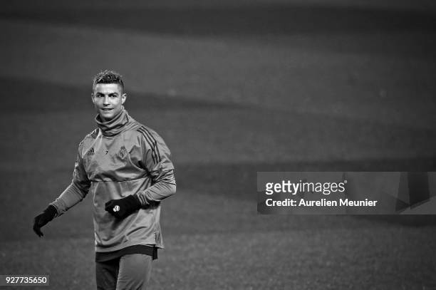 Cristiano Ronaldo warms up during a Real Madrid training session ahead of the Champion's League match against Paris Saint-Germain at Parc des Princes...