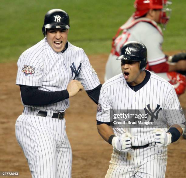 Mark Teixeira and Alex Rodriguez of the New York Yankees celebrate after scoring in the bottom of the fifth inning of Game Six of the 2009 MLB World...