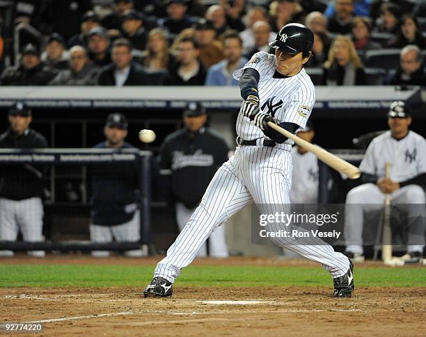 Hideki Matsui of the New York Yankees hits a two-RBI double in the bottom of the fifth inning of Game Six of the 2009 MLB World Series against the...