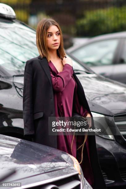 Adelaide Kane wears a purple dress, during Paris Fashion Week Womenswear Fall/Winter 2018/2019, on March 4, 2018 in Paris, France.