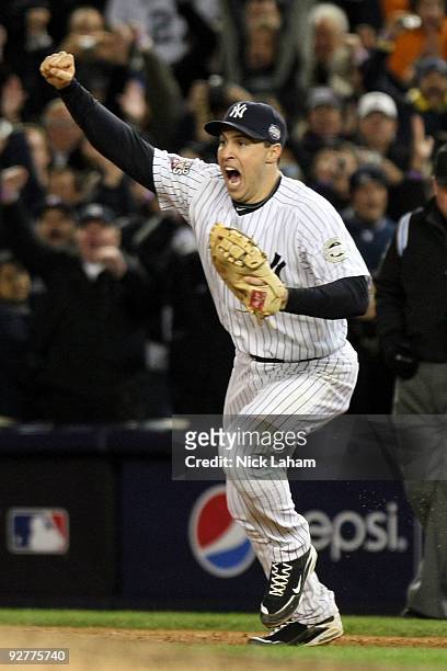 Mark Teixeira of the New York Yankees celebrates after the final out of the Yankees' 7-3 win against the Philadelphia Phillies in Game Six of the...