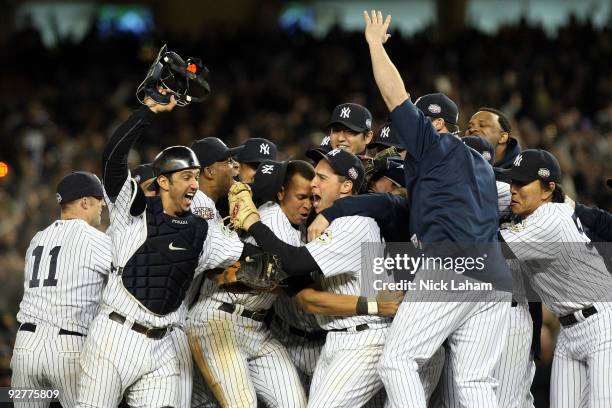 The New York Yankees celebrate after their 7-3 win against the Philadelphia Phillies in Game Six of the 2009 MLB World Series at Yankee Stadium on...