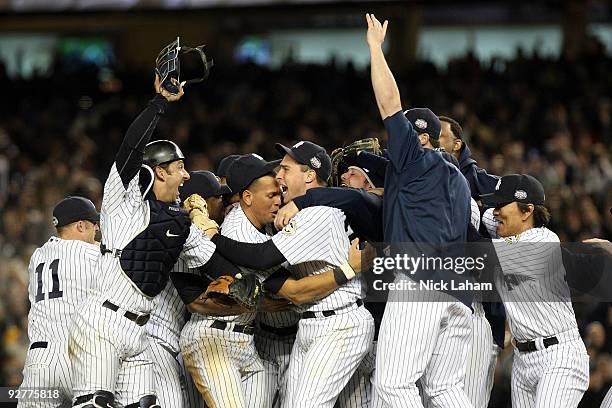 The New York Yankees celebrate after their 7-3 win against the Philadelphia Phillies in Game Six of the 2009 MLB World Series at Yankee Stadium on...