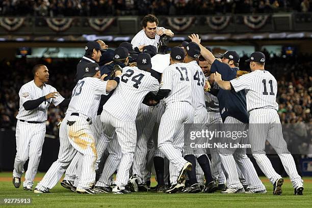 The New York Yankees celebrate after their 7-3 win against the Philadelphia Phillies in Game Six of the 2009 MLB World Series at Yankee Stadium on...