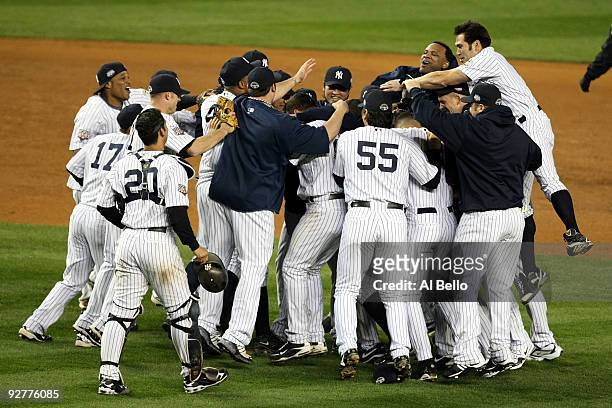 The New York Yankees celebrate after their 7-3 win against the Philadelphia Phillies in Game Six of the 2009 MLB World Series at Yankee Stadium on...