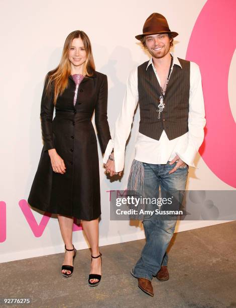 Actress Mira Sorvino and her husband Christopher Backus attend the Isaac Mizrahi Live! collection launch celebration at Stage 37 on November 4, 2009...