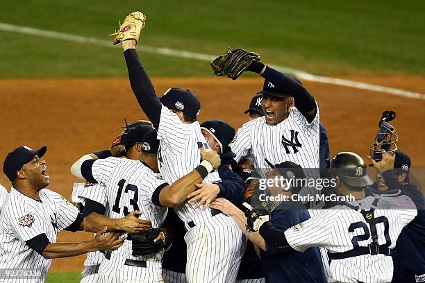 Derek Jeter of the New York Yankees celebrates with his teammates after their 7-3 win against the Philadelphia Phillies in Game Six of the 2009 MLB...