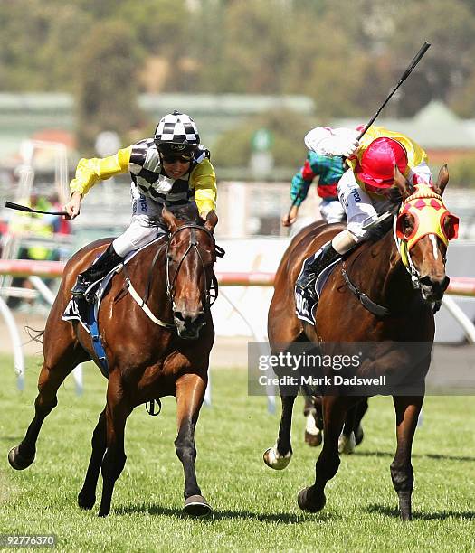 Jockey Michael Rodd riding Faint Perfume wins the Crown Oaks from Valdemoro ridden by Nicholas Hall during the 2009 Crown Oaks Day at Flemington...