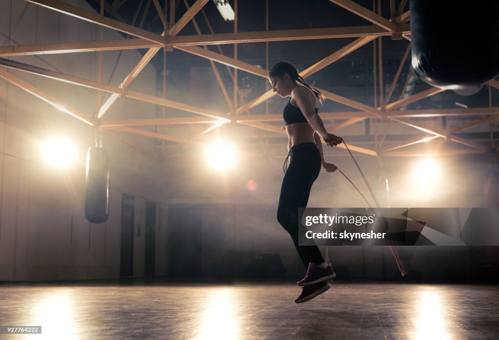 Jump Roping Woman Full Length Of Athletic Woman Exercising With Jump Rope In A Health ...