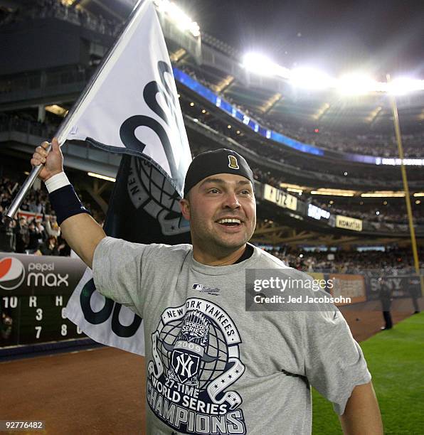 Nick Swisher of the New York Yankees celebrates on the field after their 7-3 win against the Philadelphia Phillies in Game Six of the 2009 MLB World...