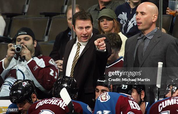 Head coach Joe Sacco of the Colorado Avalanche points to the ice against the Phoenix Coyotes at the Pepsi Center on November 4, 2009 in Denver,...