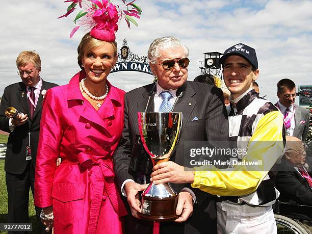 Ann Peacock of Crown, Trainer of Faint Perfurm Bart Cummings and Jockey Michael Rodd pose with the trophy after the Crown Oaks during the 2009 Crown...