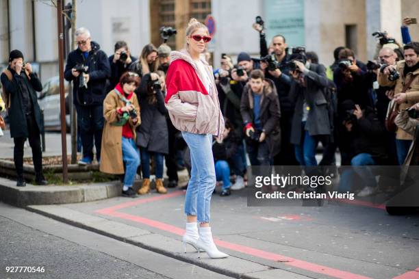 Lena Perminova is seen in front of photographers outside Giambattista Valli during Paris Fashion Week Womenswear Fall/Winter 2018/2019 on March 5,...