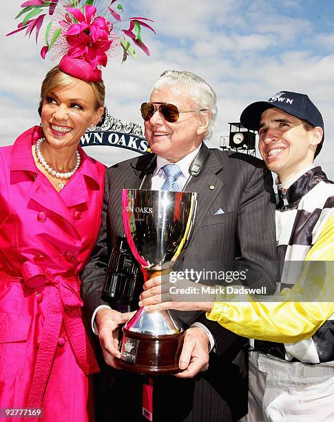 Ann Peacock of Crown, Trainer of Faint Perfurm Bart Cummings and Jockey Michael Rodd pose with the trophy after the Crown Oaks during the 2009 Crown...