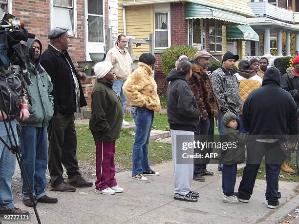 People gather near the residence of 50-year-old convicted rapist and alleged serial killer Anthony Sowell on November 4, 2009 in Cleveland, Ohio. A...